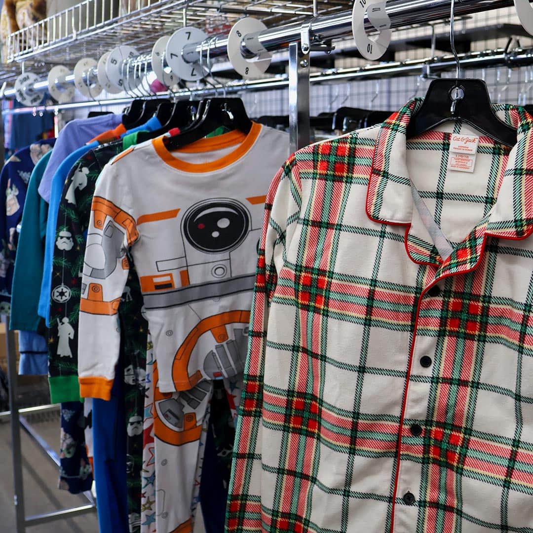 Variety of patterned children's pajamas on hangers