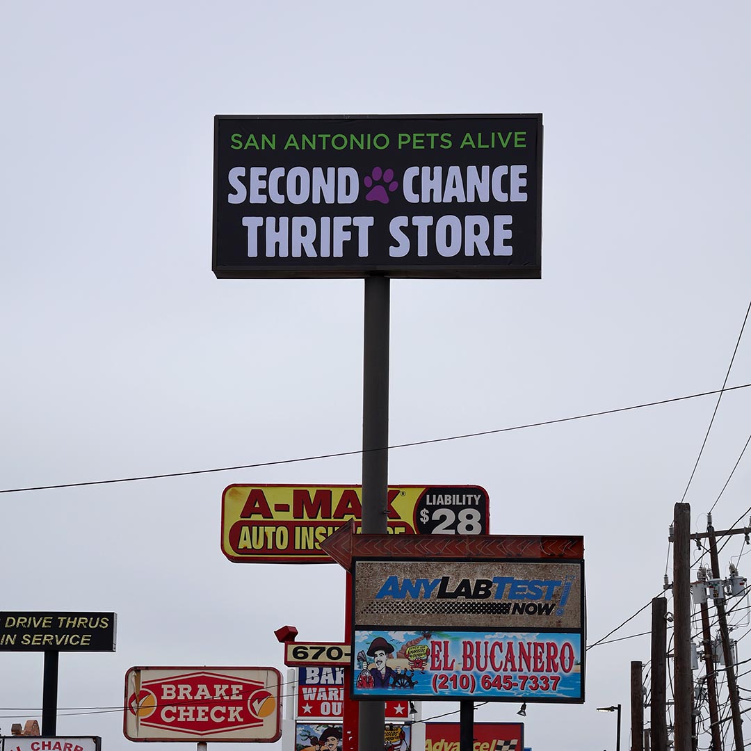 San Antonio thrift store sign among other business signs.